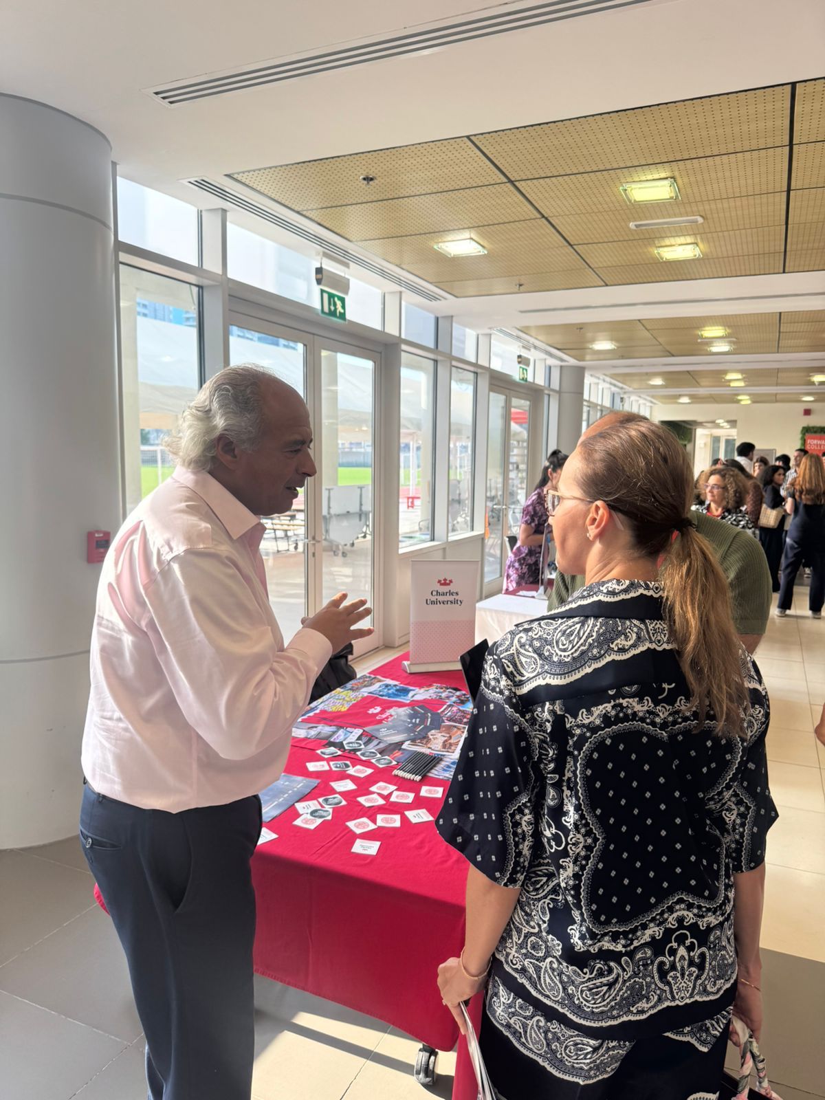 Charles University representative speaking with a counsellor