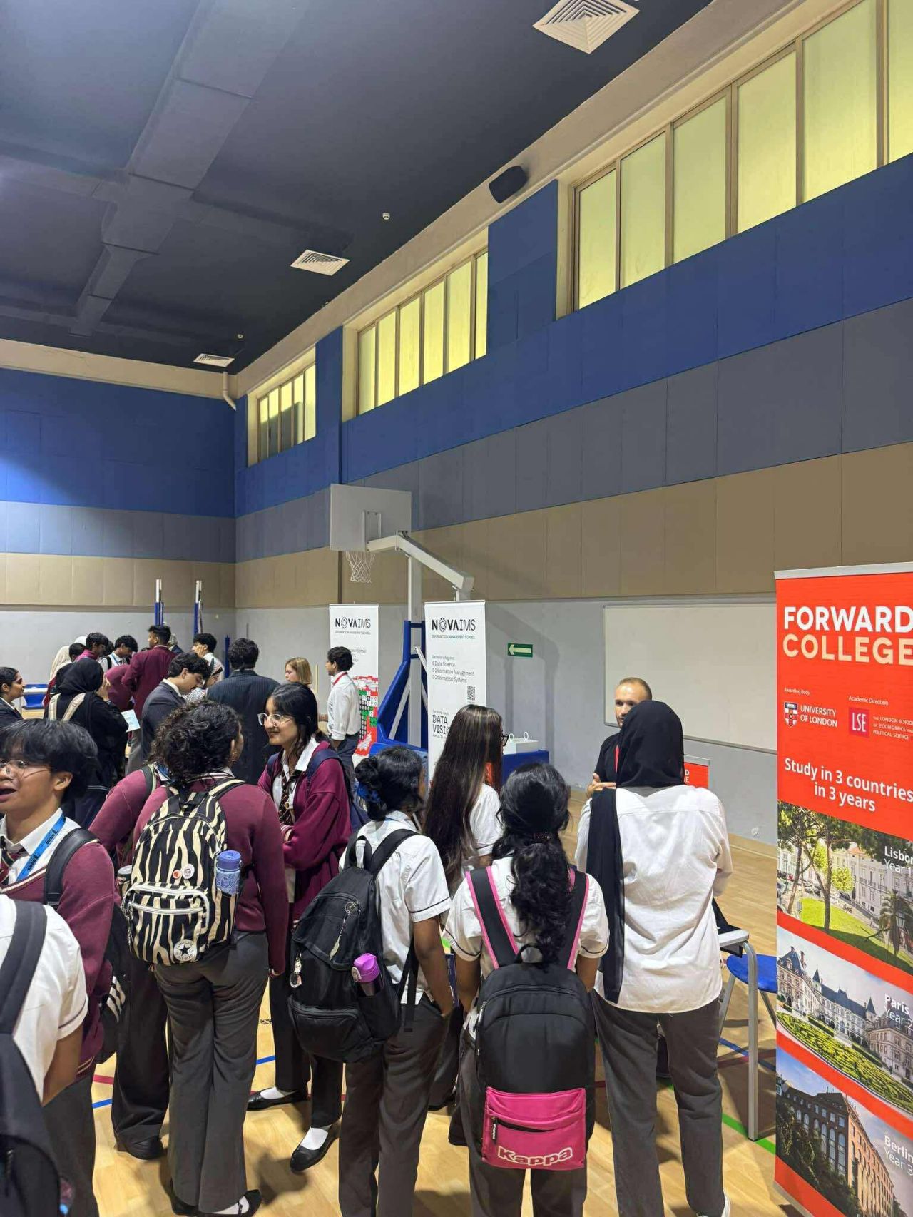 Students browsing university stands
