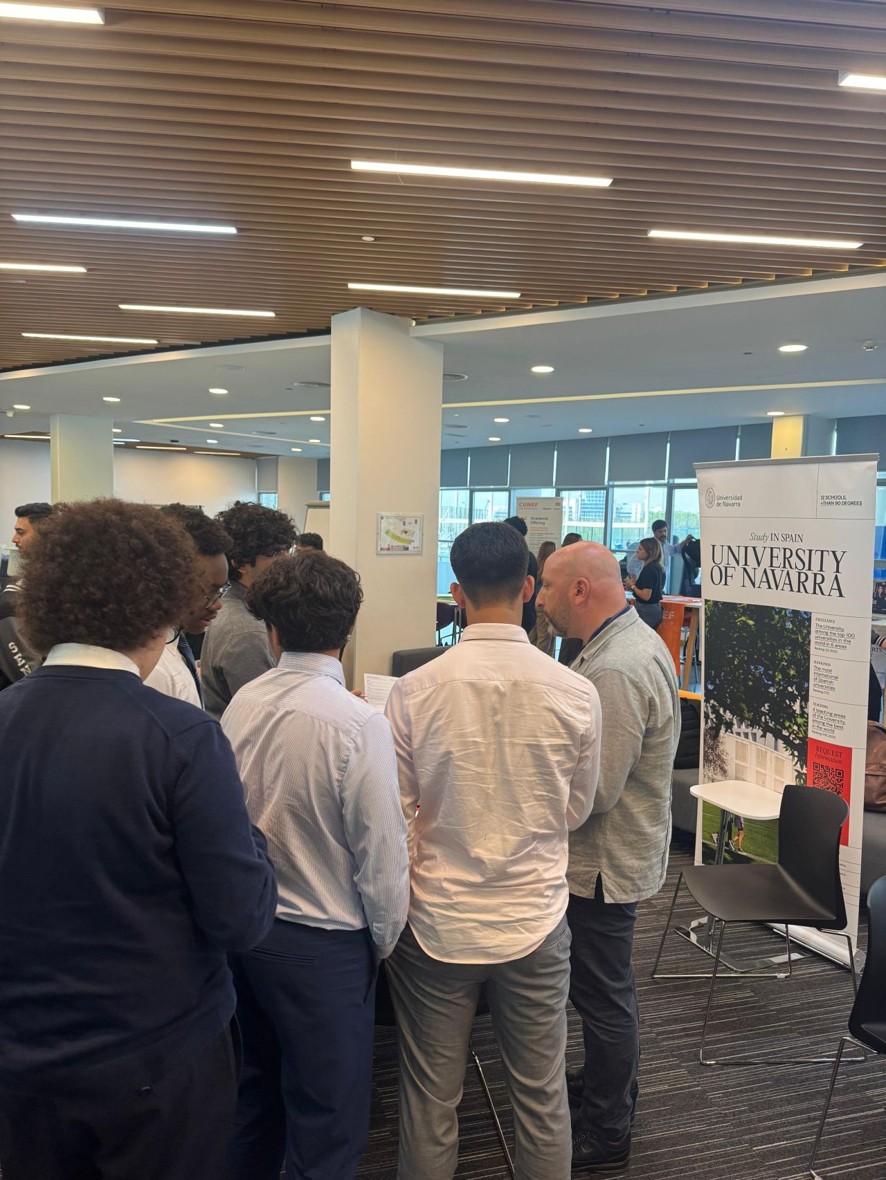 University of Navarra stand and visiting students