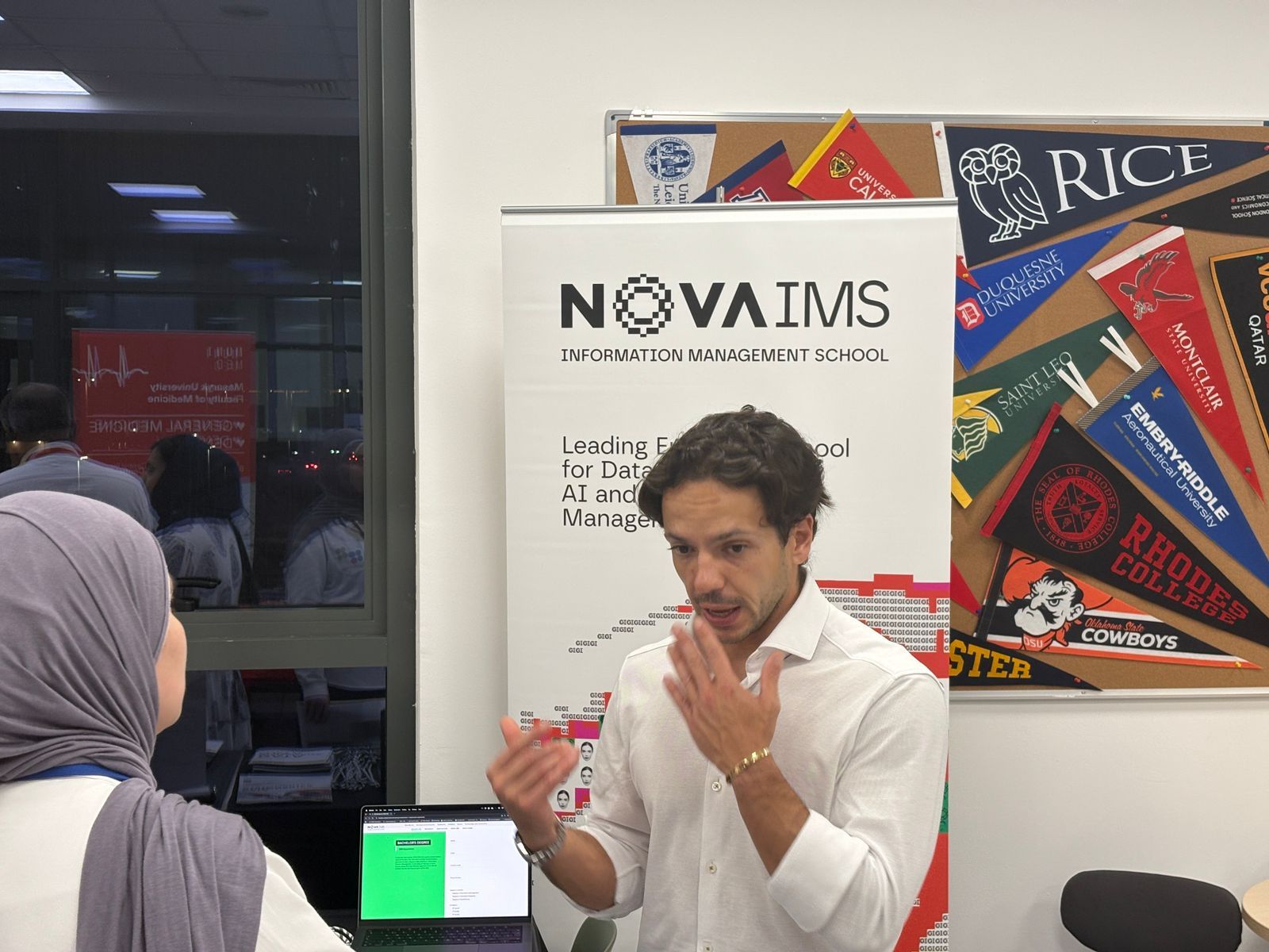 Nova IMS representative speaking with a student